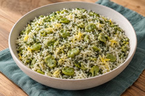 AI illustration of basmati rice with dill and peeled green fava beans.