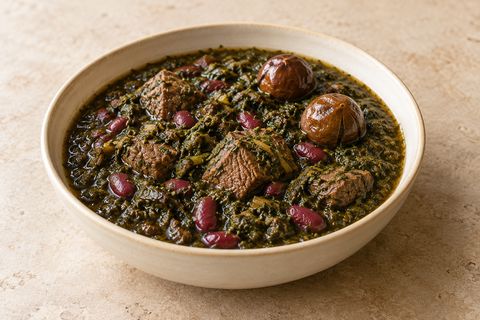 Dark green herb stew with beef, red kidney beans and whole dried limes; AI illustration.
